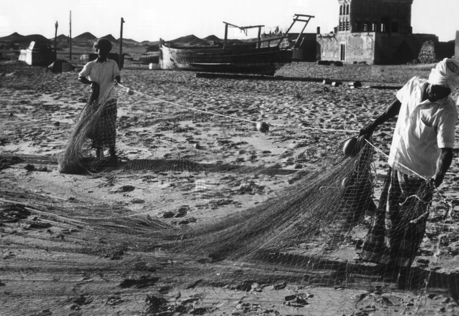 Fishermen preparing their nets for a fishing trip from Dalma Island.jpg